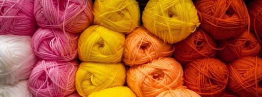 Background from multi-colored fluffy woolen threads for knitting.