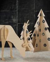 New Year's and Christmas decorations and fir plywood deer and a tree photo