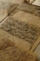 Ancient open book in arabic. Old arabic manuscripts and texts photo