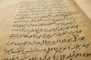 Ancient open book in arabic. Old arabic manuscripts and texts photo