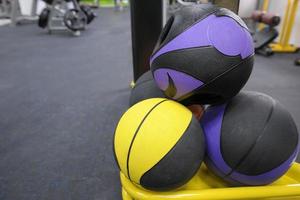 closeup of round dumbbells in the gym photo