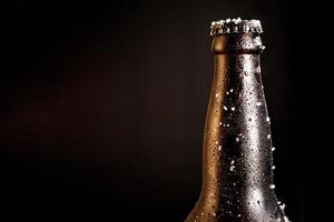 Bottle of beer with frosted ice photo