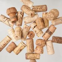 Heap of old wine corks on white background. Studio photography photo