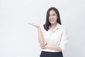 portrait of confident businesswoman wearing pink shirt isolated over white background studio photo