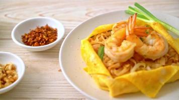 Thai stir fried noodles with shrimps and egg wrap or Pad Thai - Thai food style