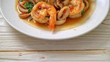 stir-fried seafood shrimps and squid with Thai basil - Asian food style video