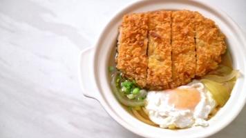 Japanese fried pork cutlet or katsudon with onion soup and egg - Asian food style