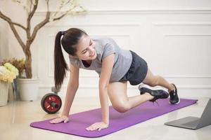fitness woman exercise in home photo