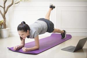 fitness woman exercise in home photo