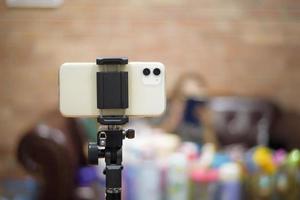 Close up smart phone with people is live for doing business at home photo