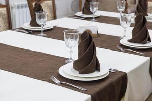 serving banquet table in a luxurious restaurant in brown and white style photo