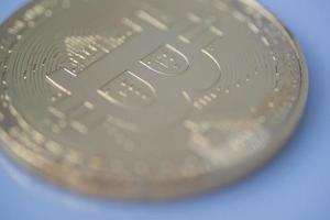 Golden bitcoin closeup, blurred photo. electronic money photo