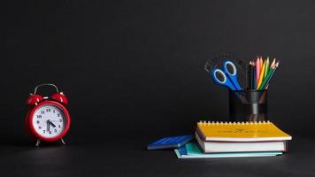 colorful collection of school supplies set on black background. back to school. great ideas photo