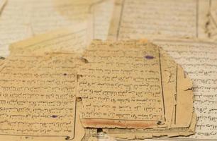 ancient old sheets of paper from the Arabic book, the Koran photo