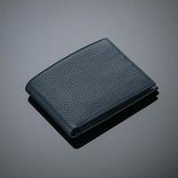 Fashionable leather men's wallet on a dark background photo