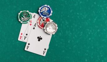 Poker chips and cards on a green background. The concept of gambling and entertainment. Casino and poker photo