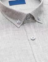 gray shirt with a focus on the collar and button, closeup photo
