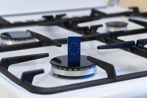 Shortage and gas crisis. European Union flag on off gas stove photo