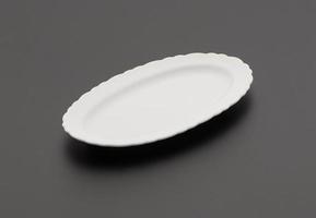 ceramic kitchen plate on black background photo