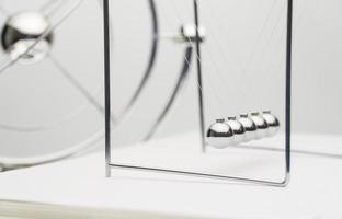 balancing balls on a white background. business concept. Newtons Cradle photo