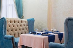 serving banquet table in a luxurious restaurant in blue and light style photo