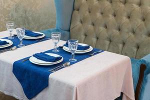 serving banquet table in a luxurious restaurant in blue and light style photo