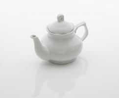 ceramic kitchen teapot on white background photo