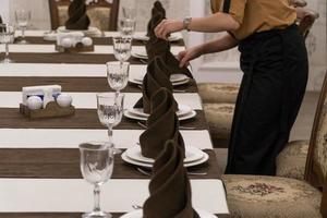 waiter serves a banquet table in a luxurious restaurant
