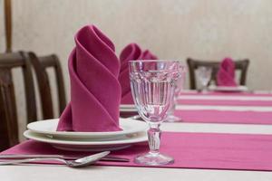 serving banquet table in a luxurious restaurant in pink and white style photo