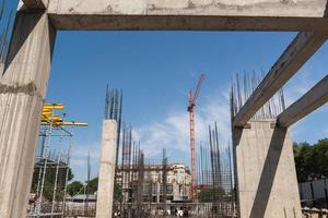 construction of a new building, concrete frame and reinforcement with crane, general view photo