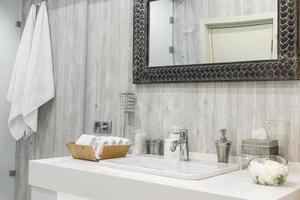 Closeup of a washbasin with a faucet in the bathroom photo