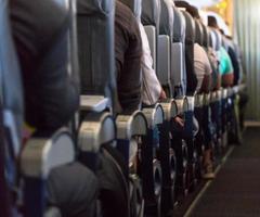 Blurred photo of the aircraft interior. Passengers in the cabin airplane