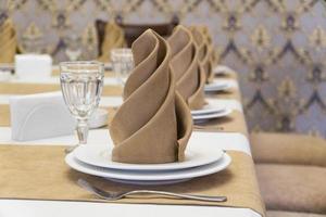 serving banquet table in a luxurious restaurant in beige and white style photo