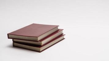 books with red cover on white background, isolated. back to school photo