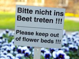Keep out of flower beds sign photo
