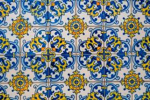 Portuguese tiles . Seamless patchwork tile with Victorian motives. Majolica pottery tile, blue and white azulejo, original traditional Portuguese and Spain decor photo