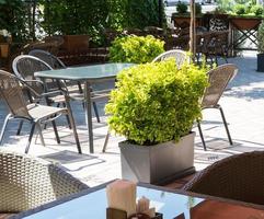 outdoor summer cafe with flower beds photo