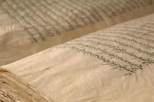 Ancient open book in arabic. Old arabic manuscripts and texts photo