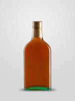 one closed bottle of cognac on white background with shadow photo