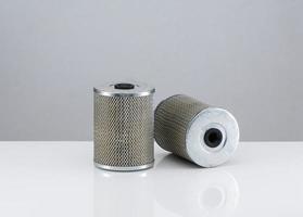 two automotive filter cylindrical shape  on a white background photo