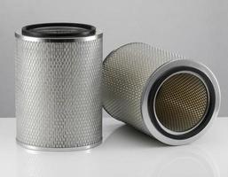 two automotive filter cylindrical shape  on a white background photo