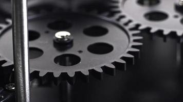 Close Up Shot Of Black Gear Cogs Rotating Working video
