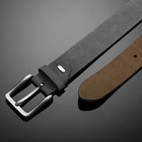 fashionable black leather men's belt on black background photo