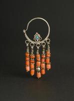 ancient antique earrings with stones on black background. Middle Asian vintage jewelry photo