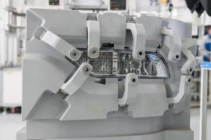 closeup factory equipment of quality control of car headlight. testing for compliance with the standard and size photo