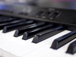 Close-up of keyboard piano keys. Close frontal view music instrument song abstract education background
