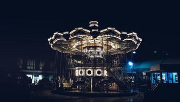 Merry-Go-Round carousel beautiful lighting decoration illuminated at night time happy
