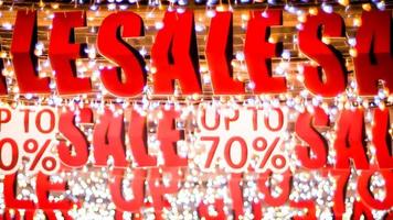 Store sale sign. Special offer banner with the red sale text gold bokeh blur background photo