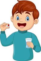 niño de dibujos animados sosteniendo una pastilla y un vaso de agua vector