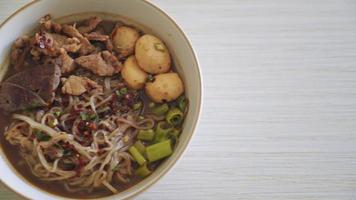 Thai noodle with pork, stewed pork, meatball and pork liver in blood soup - Thai noodles style video